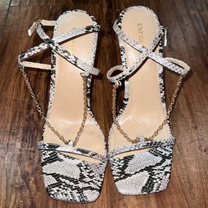 Faux snake skin single strap heel sandals with gold chains.